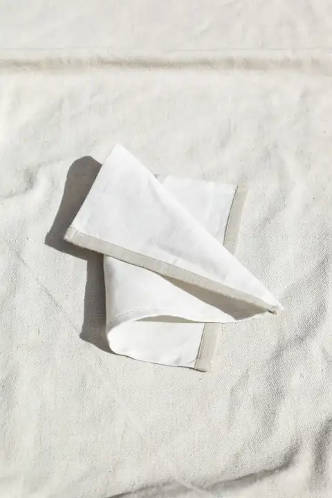 Roti rumal & napkins: a paper chair on a carpet