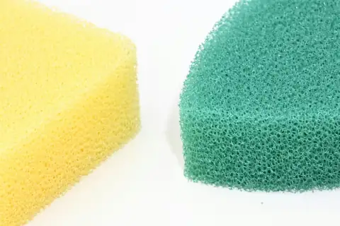 Scrubbers & sponges: A sponge and a sponge on a white surface