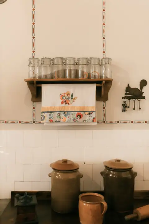 Roti rumal & napkins: Kitchen shelf with jars and decorative towel