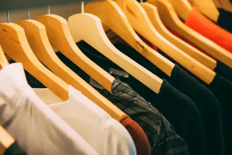 Hangers & clips: clothes hanged on brown wooden hanger