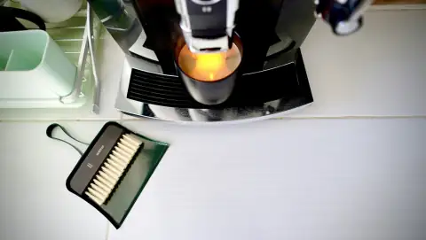 Dustpans: A coffee machine with a dustpan and brush