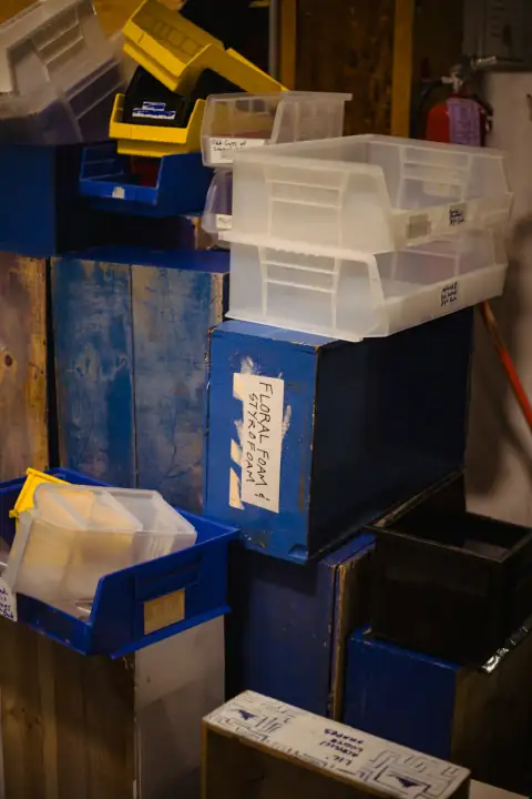 Tubs & tokna: Messy storage room with blue boxes and clear bins