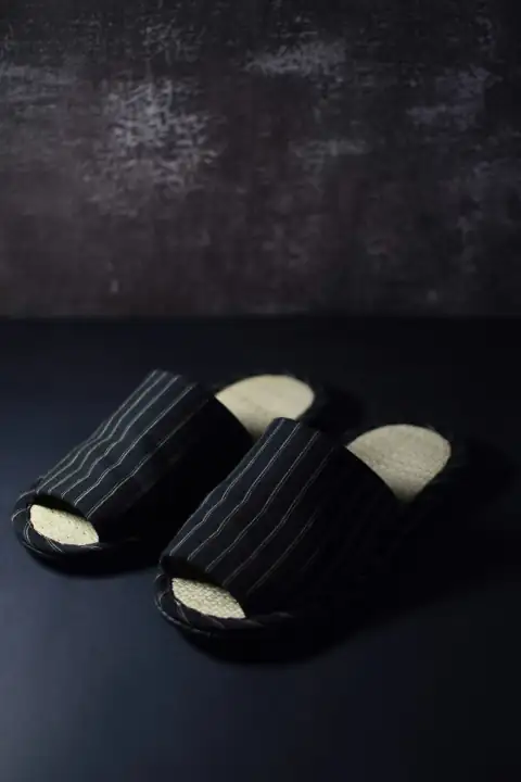 Slippers: a pair of black and white striped shoes