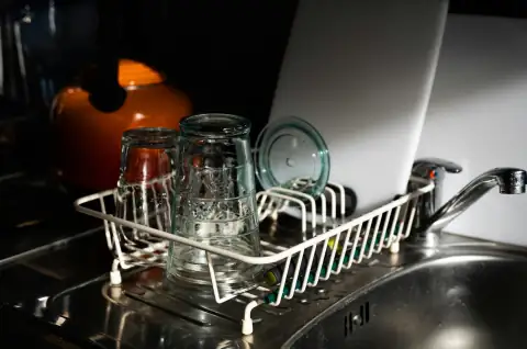 Racks: clear glass mugs on white metal rack