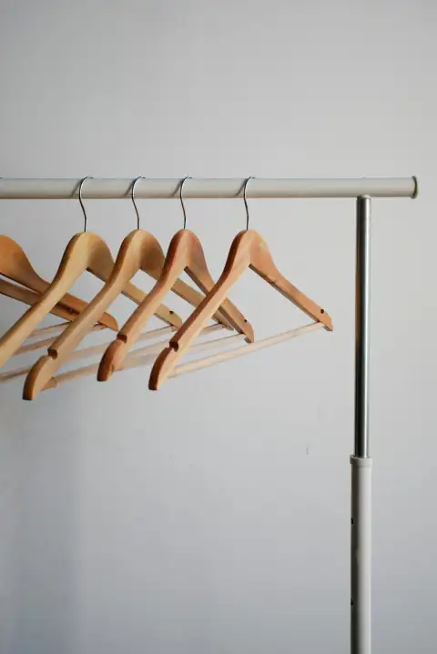 Hangers & clips: four brown wooden clothes hangers