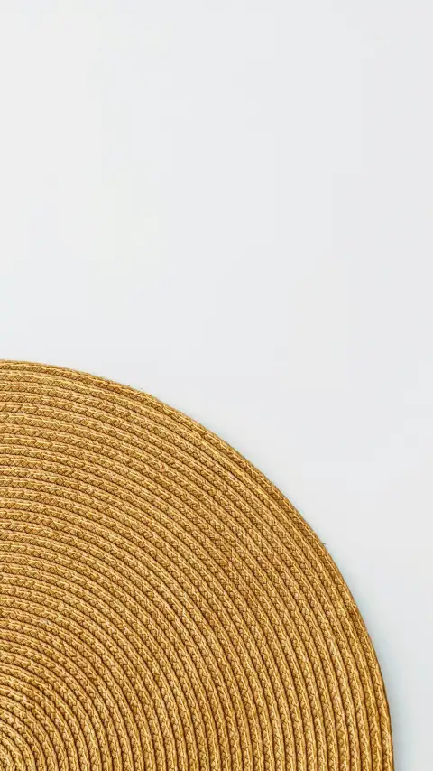 Chatai mats: brown round textile on white surface