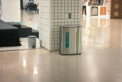 Dustbins: Two recycling bins in a modern interior space