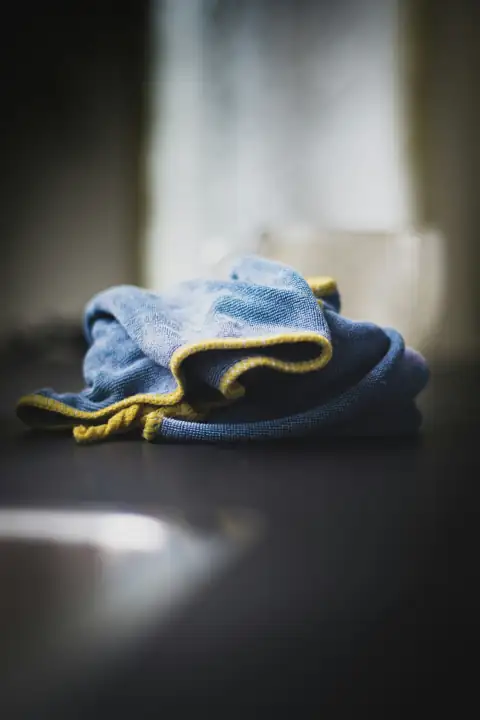 Dusters: blue denim textile on black table