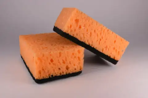 Scrubbers & sponges: brown bread on white table