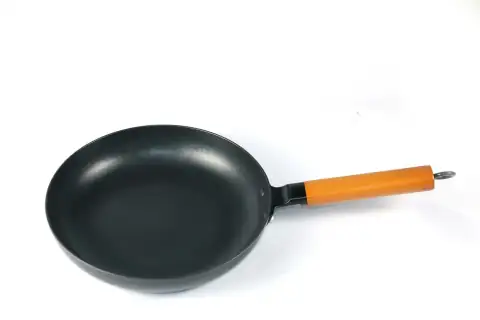 Tawa: black and orange frying pan
