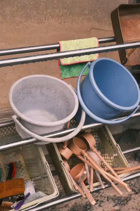 Buckets: Two buckets and ladles on a rack